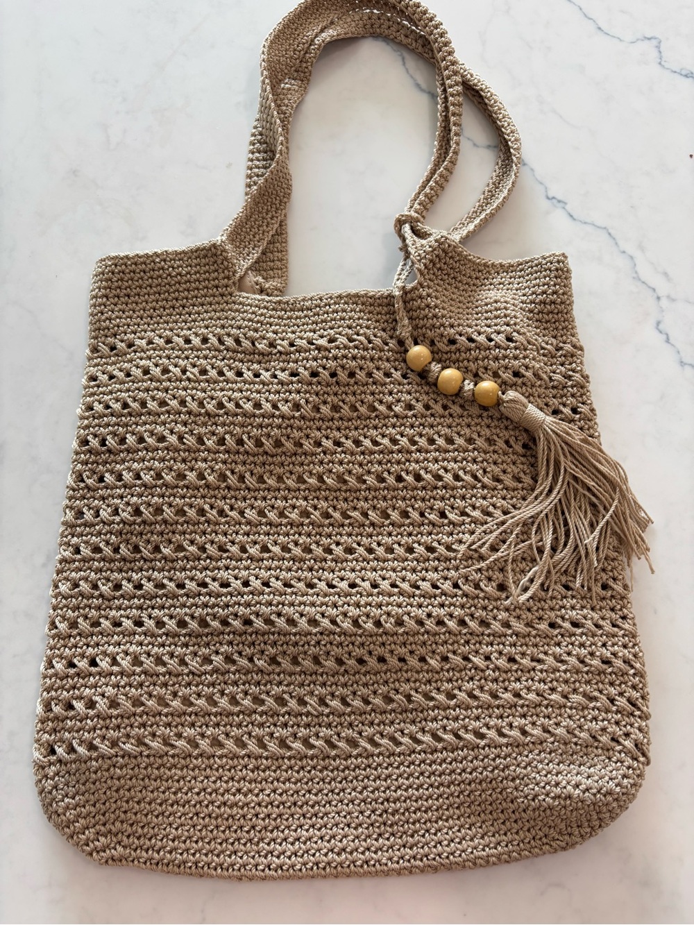 Tommy Bahama  Beige Crochet shoulder Bag with Tassel Detail